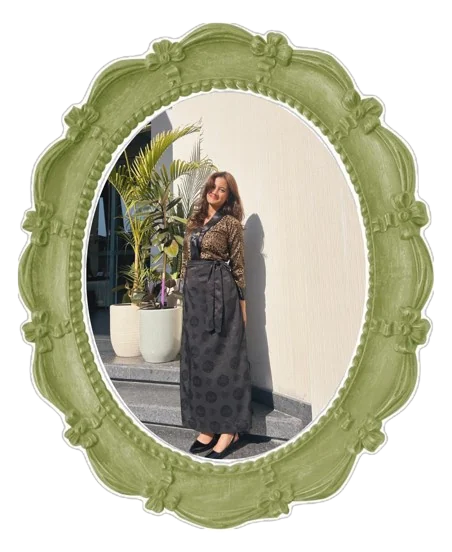 Portrait of Gracy Titung in an ornate green frame